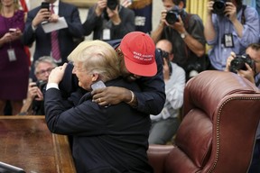 Rapper Kanye West hugs President Donald Trump during a meeting in the Oval Office of the White House on October 11, 2018 in Washington, DC.