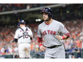 Steve Pearce #25 of the Boston Red Sox reacts after scoring a run in the eighth inning against the Houston Astros during Game Three of the American League Championship Series at Minute Maid Park on October 16, 2018 in Houston, Texas.