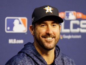 Justin Verlander #35 of the Houston Astros talks with the media during a press conference before Game Four of the American League Championship Series against the Boston Red Sox at Minute Maid Park on October 17, 2018 in Houston, Texas.