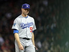 Ryan Madson #50 of the Los Angeles Dodgers reacts after allowing runs during the fifth inning against the Boston Red Sox in Game Two of the 2018 World Series at Fenway Park on October 24, 2018 in Boston, Massachusetts. (Photo by Elsa/Getty Images)