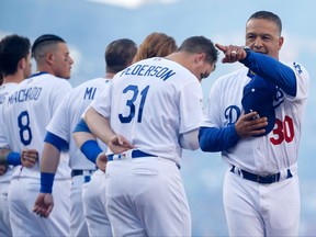 Los Angeles Dodgers manager Dave Roberts, right, is introduced prior to Game 3 of the 2018 World Series against the Boston Red Sox at Dodger Stadium on Oct. 26, 2018 in Los Angeles, Calif.  (Pool/Getty Images)