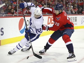 Nazem Kadri #43 of the Toronto Maple Leafs and Lars Eller #20 of the Washington Capitals battle for the puck during the second period at Capital One Arena on October 13, 2018 in Washington, DC. (Patrick Smith/Getty Images)