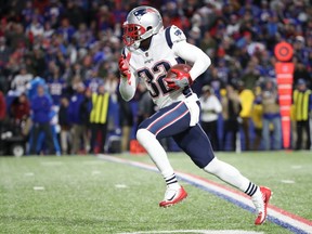 Devin McCourty #32 of the New England Patriots intercepts a pass and runs it back the length of the field for a touchdown during NFL game action against the Buffalo Bills at New Era Field on October 29, 2018 in Buffalo, New York. (Photo by Tom Szczerbowski/Getty Images)