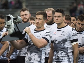 Toronto Wolfpack teammates look on after finishing losing to the London Broncos on Sunday. (THE CANADIAN PRESS)