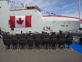 Royal Canadian Sea Cadets wait for the start of the naming ceremony for Canada's lead Arctic and Offshore Patrol Ship, the future HMCS Harry DeWolf, at Halifax Shipyard in Halifax on Friday, Oct. 5, 2018. (THE CANADIAN PRESS)