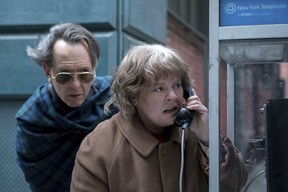 This image released by Fox Searchlight Pictures shows Richard E. Grant, left, and Melissa McCarthy in a scene from “Can You Ever Forgive Me?” (Mary Cybulski/Fox Searchlight Pictures)