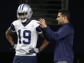 Dallas Cowboys receiver Amari Cooper  listens to wide receivers coach Sanjay Lal during practice on Wednesday. AP PHOTO