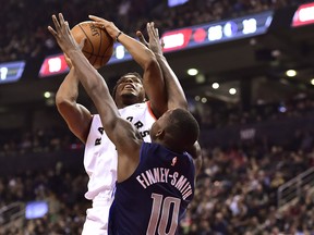 Raptors guard Kyle Lowry drives to the net as Dallas Mavericks forward Dorian Finney-Smith tries to defend on Friday night. (THE CANADIAN PRESS)