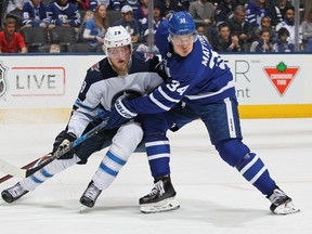 Patrik Laine #29 of the Winnipeg Jets skates against Auston Matthews #34 of the Toronto Maple Leafs during an NHL game at the Air Canada Centre on March 31, 2018 in Toronto. (Claus Andersen/Getty Images)