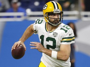 Packers quarterback Aaron Rodgers looks for a receiver against the Lions during NFL action in Detroit on Oct. 7, 2018.