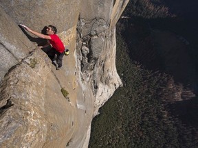 This handout photo obtained October 3, 2018 courtesy of National Geographic/Jimmy Chin shows Alex Honnold free solo climbing on El Capitan's Freerider in Yosemite National Park, becoming the first person to climb El Capitan without a rope. - A new documentary follows Alex Honnold as he attempts a free solo ascent of El Capitans Freerider in Yosemite National Park in California. Imagine climbing a 900-meter (3,000-foot) granite wall without ropes and almost nothing to grip, moving slowly and perilously upward for four hours. A brave soul named Alex Honnold completed such a climb -- and lived to tell the tale. Honnold was 31 when he pulled off the feat of scaling El Capitan, a vertical rock formation in Yosemite National Park in California, in June 2017 in a drama that is now the subject of a National Geographic documentary. The film is in US theaters now, in Canada starting October 12 and in the UK in December.