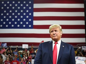 In this file photo taken on Oct. 1, 2018, U.S. President Donald Trump arrives to speak during a "Make America Great Again" rally at Freedom Hall Civic Center in Johnson City, Tenn.