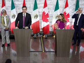 Minister of Foreign Affairs Chrystia Freeland, second from right, and Mexico's Secretary-designate of Foreign Affairs, Marcelo Ebrard, second from left, Jim Carr, right, Minister for International Trade Diversification and Graciela Marquez, Mexicos Secretary-designate for Economy speak following the press conference at Global Affairs in Ottawa, on Oct. 22, 2018. (LARS HAGBERG/AFP/Getty Images)