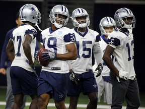 Dallas Cowboys receiver Amari Cooper (19) goes through drills with receivers during practice in Frisco, Texas, Wednesday, Oct. 24, 2018. (AP Photo/Michael Ainsworth)
