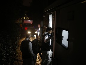 Turkish forensic officers arrive at the Saudi consulate to conduct a new search over the disappearance and alleged slaying of writer Jamal Khashoggi, in Istanbul, early Thursday, Oct. 18, 2018.