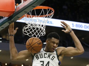 Milwaukee Bucks' Giannis Antetokounmpo dunks during the second half of an NBA basketball game against the Philadelphia 76ers, Wednesday, Oct. 24, 2018, in Milwaukee. The Bucks won 123-108. (AP Photo/Aaron Gash)