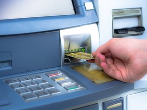 Withdrawing cash from an ATM. Files