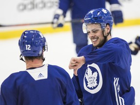 Maple Leafs’ Auston Matthews gives Patrick Marleau the thumbs down during practice on Friday. (CRAIG ROBERTSON/TORONTO SUN)