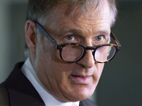 Maxime Bernier speaks with the media after filing papers for the Peoples Party of Canada at the Elections Canada office in Gatineau, Que., Wednesday, October 10, 2018.