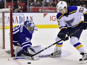 Maple Leafs goalie Frederik Andersen makes a save on St. Louis Blues winger David Perron on Saturday at Scotiabank Arena. Toronto's effort was less than inspiring, writes Terry Koshan. (Frank Gunn/The Canadian Press)