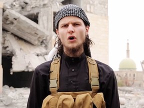 Dressed in the garb of the mujahideen, John Maguire is shown on six-minute video that contains a dire warning to Canadians and praises acts of Islamist extremism.