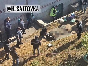 Cops at the crime scene in Ukraine where a father and son cannibal tag team have been arrested.