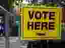 A sign directing people where to vote in advance polls. (THE CANADIAN PRESS)