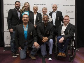The Class of 2018 — (back row, from left) Alexandre Despatie, Chandra Crawford, Dr. Sandra Kirby, Maureen Baker (daughter of Mary Baker), Dave Keon and (front row, from left) Wilton Littlechild, Damon Allen and Jeff Adams — pose for a group photo after a media event in Toronto yesterday, as they are inducted into Canada’s Sports Hall of Fame.       THE CANADIAN PRESS/Chris Young