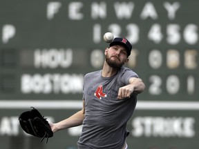 Boston Red Sox pitcher Chris Sale throws during a workout at Fenway Park, Friday, Oct. 12, 2018, in Boston. (AP Photo/Elise Amendola)