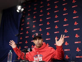 Boston Red Sox manager Alex Cora speaks to media during a baseball workout at Fenway Park, Sunday, Oct. 21, 2018, in Boston. (AP PHOTO)