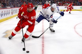 Niklas Kronwall of the Detroit Red Wings battles for the puck with Mitch Marner of the Maple Leafs on Thursday night in Detroit. (GETTY IMAGES)