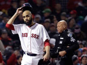 Boston Red Sox pitcher David Price walks off the infield after allowing two runs during the fourth inning of Game 2 of the World Series baseball game against the Los Angeles Dodgers Wednesday, Oct. 24, 2018, in Boston. (AP Photo/David J. Phillip)