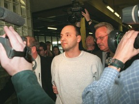 Andrew Urdiales does the perp walk in Chicago in the 1990s. He has been sentenced to death for a California killing spree.
