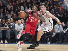 Raps’ Delon Wright (left) drives to the basket as Nets’ Rodions Kurucs defends during a 
pre-season game in Montreal. Wright returns tonight after sitting out with a groin injury. (THE CANADIAN PRESS)