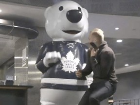 Carlton the Bear scares members of the Maple Leafs in a Halloween prank. (Screengrab)