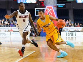 Carleton Ravens guard Emmanuel Owootoah guards the Ryerson Rams' Myles Charvis during a U Sports men's basketball championship semifinal against the Ryerson Rams on Saturday, March 10, 2018. Carleton lost 84-76, ending its seven-year reign as national champion. Trevor MacMillan/U Sports photo