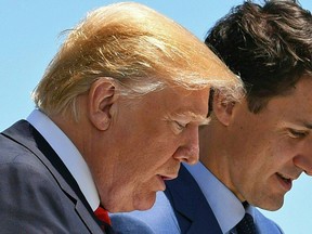 US President Donald Trump (L) speaks with Canadian Prime Minister Justin Trudeau during the G7 Summit in La Malbaie, Quebec, Canada, June 8, 2018. / AFP PHOTO / SAUL LOEBSAUL LOEB/AFP/Getty Images