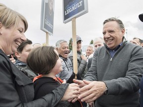 CAQ Leader Francois Legault greets supporters during a campaign stop in Saint-Jean-sur-Richelieu, Que., Sunday, Sept. 30, 2018.