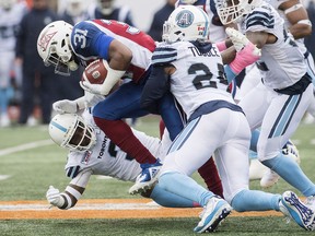 Montreal Alouettes' William Stanback (31) pushes through Toronto Argonauts defense during first half CFL football action in Montreal, Sunday, Oct. 28, 2018. THE CANADIAN PRESS/Graham Hughes