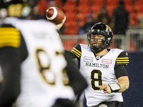 Hamilton Tiger-Cats quarterback Jeremiah Masoli (8) throws the ball during second half CFL football action against the Toronto Argonauts, in Toronto on Friday, Oct. 12, 2018. THE CANADIAN PRESS/Christopher Katsarov