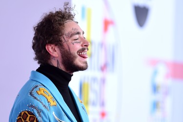 US rapper Post Malone arrives at the 2018 American Music Awards on October 9, 2018, in Los Angeles, California. (Photo by Valerie MACON / AFP)