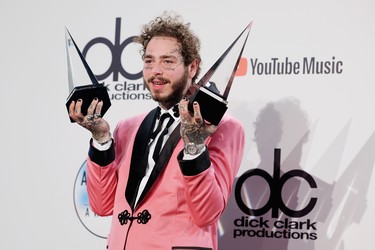 LOS ANGELES, CA - OCTOBER 09:  Post Malone, winner of the Favorite Male Artist - Pop/Rock award poses in the press room during the 2018 American Music Awards at Microsoft Theater on October 9, 2018 in Los Angeles, California.  (Photo by Matthew Simmons/Getty Images For dcp)