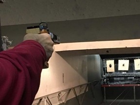 A gun enthusiast takes aim at a Toronto gun club. (Sue-Ann Levy, Toronto Sun)