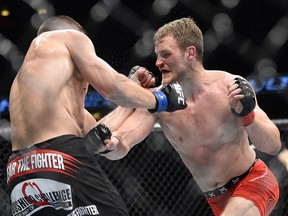 Iceland's Gunnar Nelson (right) battles Rick Story during the Fight Night card at the Globe Arena in Stockholm on October 4, 2014. (JONATHAN NACKSTRAND/AFP/Getty Images)