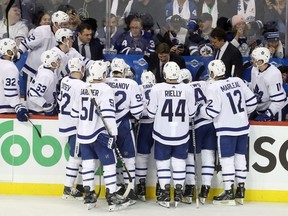 Toronto Maple Leafs head coach Mike Babcock instructs his team during a stop in play against the Winnipeg Jets during third period hockey action in Winnipeg, Wednesday, October 24, 2018.