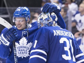 Toronto Maple Leafs' Auston Matthews (left) celebrates with goaltender Frederik Andersen after defeating the Montreal Canadiens on April 7, 2018. THE CANADIAN PRESS/Chris Young