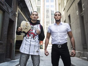 Featherweight champion Max Holloway, left, and unbeaten challenger Brian Ortega pose for a photograph before their upcoming UFC 231 title fight in Toronto on Wednesday, October 10, 2018. (THE CANADIAN PRESS/Nathan Denette)