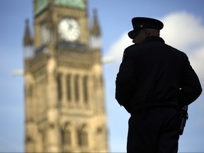 A House of Commons security guard is photographed on Parliament Hill Tuesday October 20, 2015.  (Darren Brown/Ottawa Citizen)