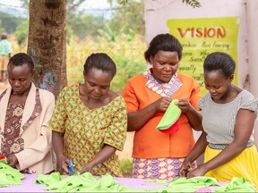 Women work to make reusable tampons. (Supplied photo)
