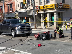 Toronto Police investigate at College and Ossington after a senior on a mobility scooter was hit by a pickup truck on Wednesday, Oct. 10, 2018. (Ernest Doroszuk/Toronto Sun)